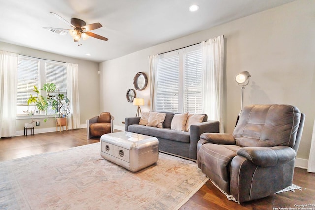 living area with dark wood finished floors, recessed lighting, visible vents, ceiling fan, and baseboards