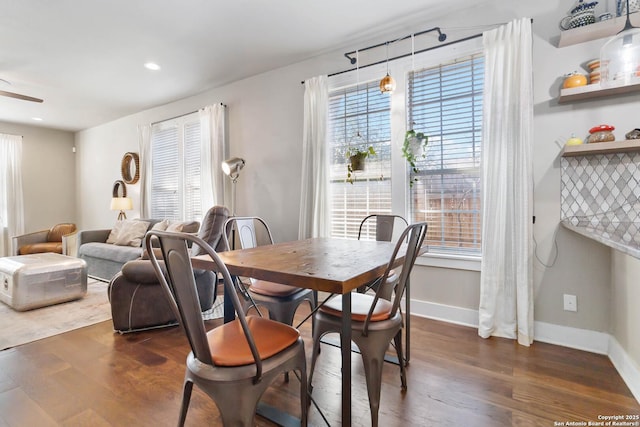 dining area with dark wood-style floors, recessed lighting, and baseboards