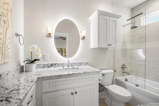 bathroom with vanity, toilet, and bathing tub / shower combination