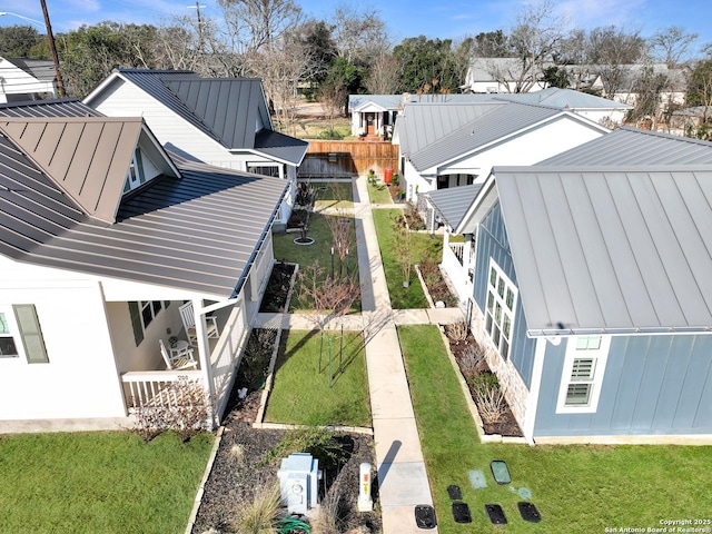 birds eye view of property with a residential view