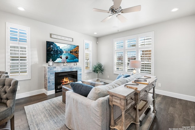 living room featuring recessed lighting, wood finished floors, and baseboards