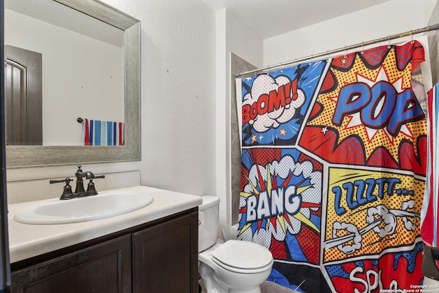 full bath featuring toilet, a shower with shower curtain, and vanity