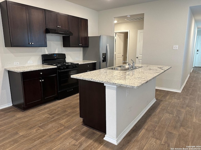 kitchen featuring stainless steel fridge with ice dispenser, dark wood-type flooring, black range with gas stovetop, under cabinet range hood, and a sink