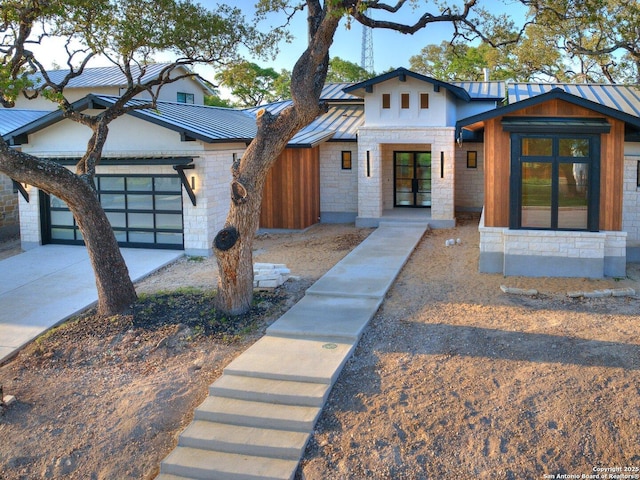 116 Chama Dr, Boerne, TX 78006 - contemporary home featuring a standing seam roof, stucco siding, metal roof, stone siding, and driveway