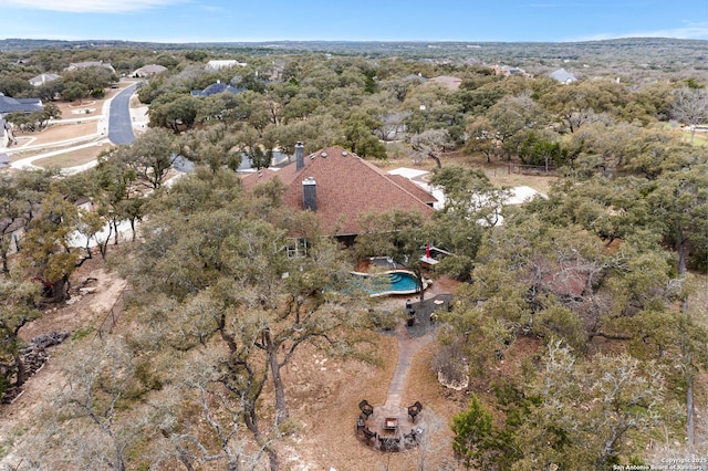 drone / aerial view with a view of trees