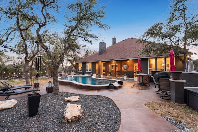 outdoor pool with a patio