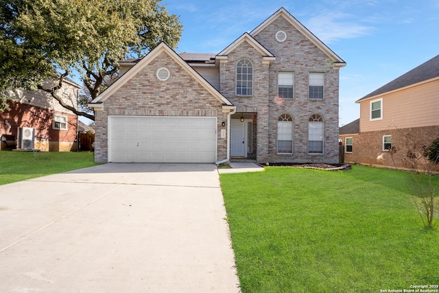 traditional-style home featuring a garage, brick siding, and a front yard