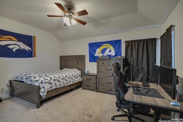 bedroom featuring a ceiling fan, vaulted ceiling, and carpet flooring