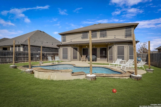 view of swimming pool with a patio area, a fenced backyard, a sunroom, and a yard