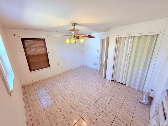 empty room with visible vents and a ceiling fan