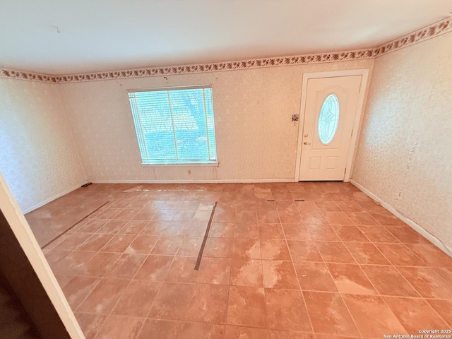 entryway featuring baseboards