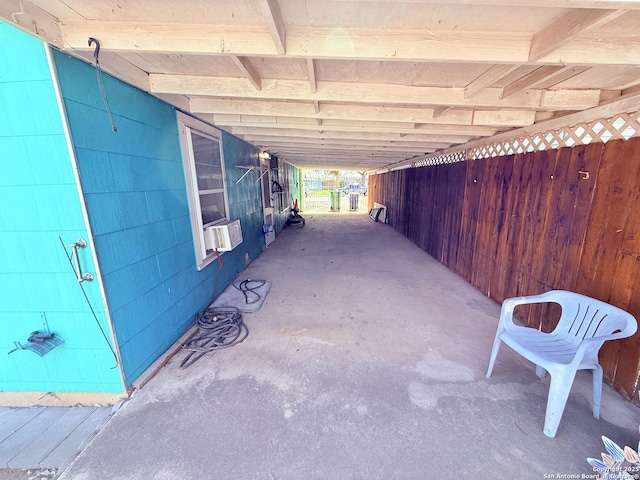 view of patio / terrace featuring a carport and cooling unit