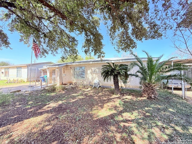 view of front of property featuring brick siding