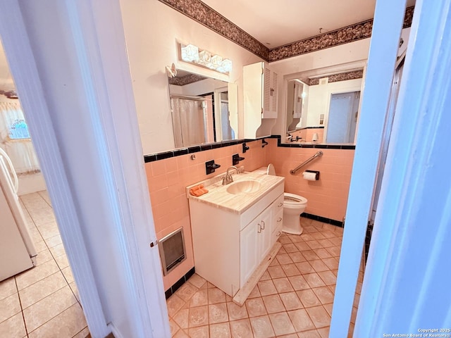 full bath featuring tile walls, toilet, and tile patterned floors