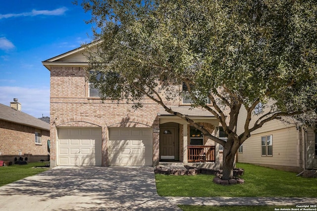 view of front facade with driveway, brick siding, a front lawn, and an attached garage