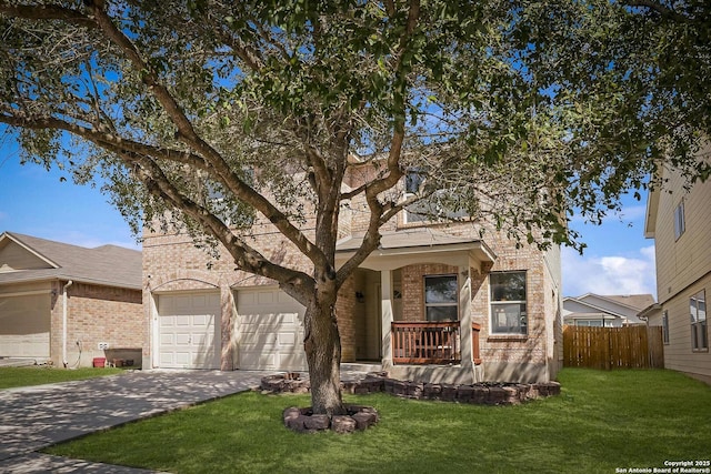 view of front of house with covered porch, brick siding, fence, concrete driveway, and a front lawn