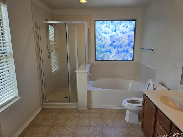 bathroom with a wealth of natural light, a stall shower, vanity, and a bath