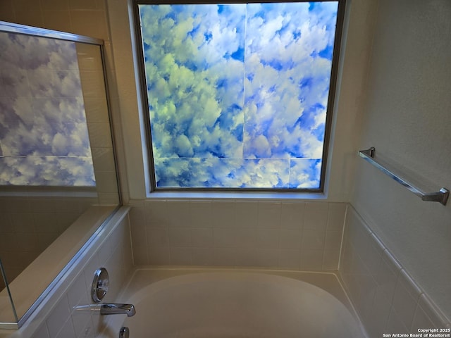 bathroom featuring an enclosed shower and a bath