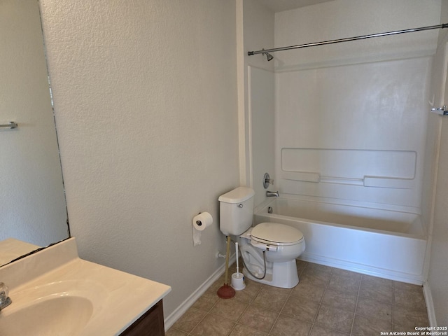 full bathroom featuring bathing tub / shower combination, toilet, vanity, baseboards, and tile patterned floors