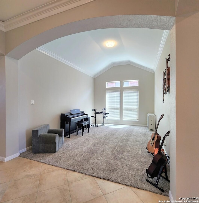 living area featuring arched walkways, lofted ceiling, carpet floors, baseboards, and ornamental molding