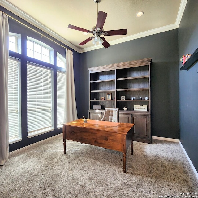 carpeted office featuring ornamental molding, a ceiling fan, and baseboards