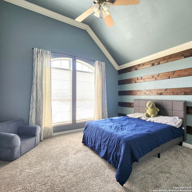 bedroom with ornamental molding, carpet flooring, vaulted ceiling, a textured ceiling, and ceiling fan