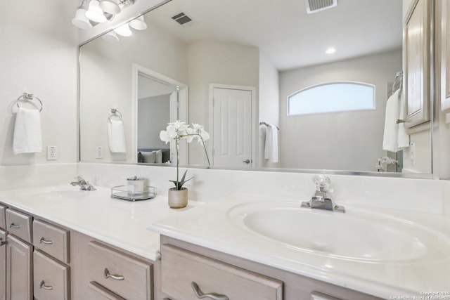 bathroom featuring visible vents and vanity