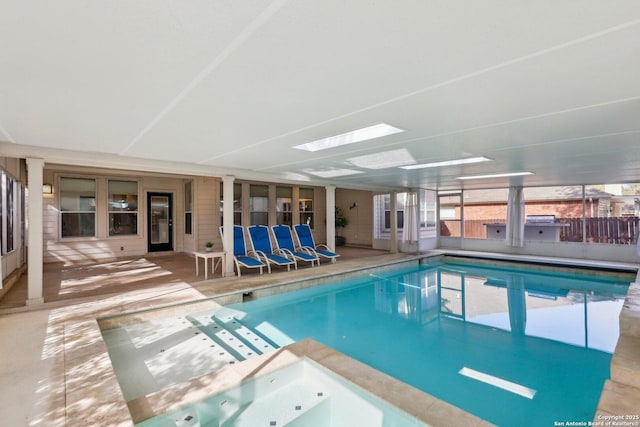 pool featuring a skylight