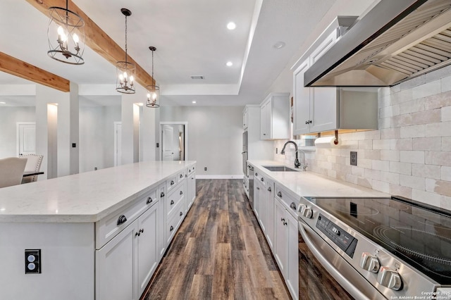 kitchen featuring extractor fan, a kitchen island, a sink, electric stove, and backsplash