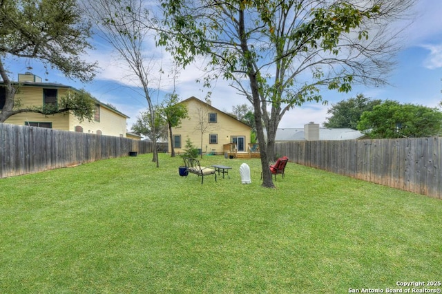 view of yard featuring a fenced backyard