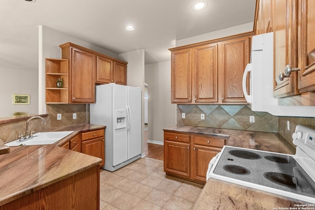 kitchen with open shelves, white appliances, brown cabinetry, and a sink