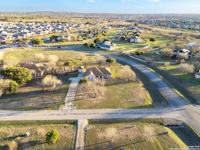 birds eye view of property with a residential view