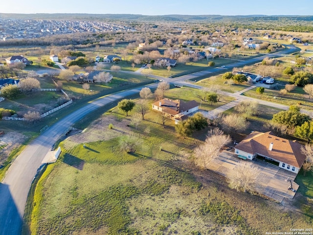 birds eye view of property with a rural view