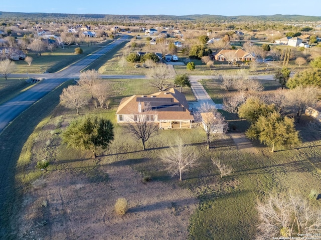 birds eye view of property with a rural view