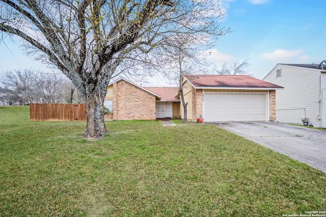 view of front of house featuring an attached garage, brick siding, fence, concrete driveway, and a front lawn