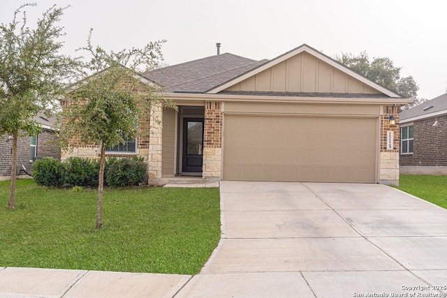 view of front of home featuring a garage, brick siding, driveway, a front lawn, and board and batten siding