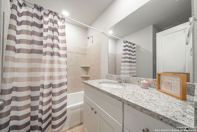 bathroom with shower / bath combo with shower curtain and vanity