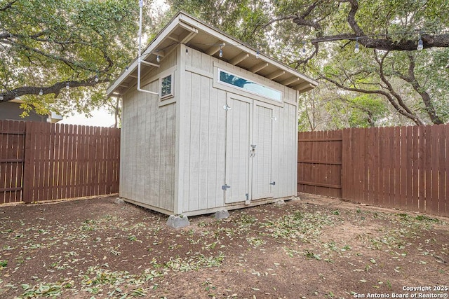 view of shed featuring a fenced backyard