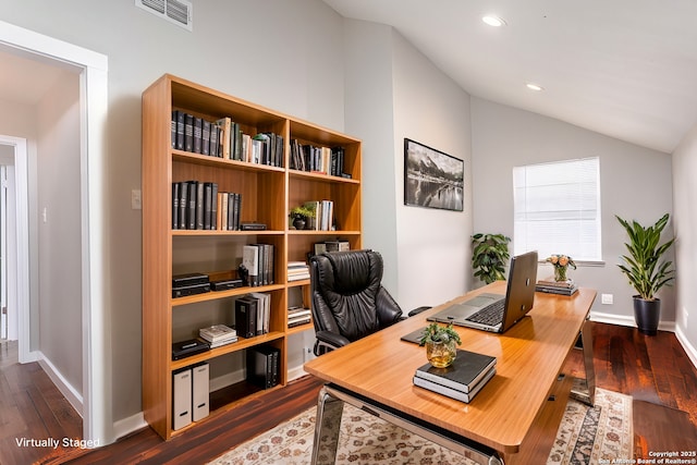 office space featuring vaulted ceiling, dark wood finished floors, visible vents, and recessed lighting