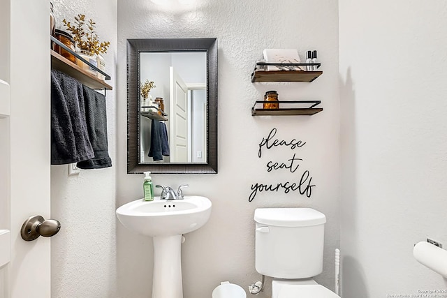 bathroom featuring toilet