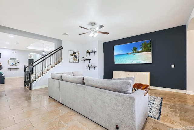 living room featuring ceiling fan, recessed lighting, visible vents, baseboards, and stairs