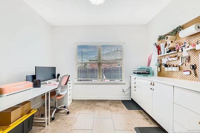 office with light tile patterned flooring and baseboards