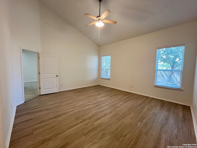 6731 Indian Ldg, San Antonio, TX 78253 - unfurnished room with high vaulted ceiling, wood finished floors, a ceiling fan, and baseboards