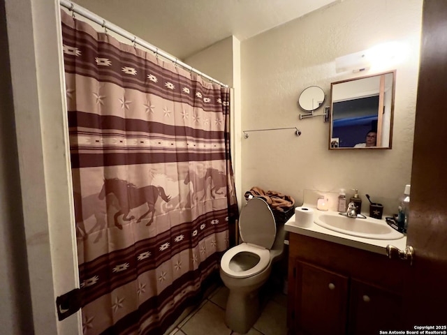 bathroom with toilet, a shower with shower curtain, tile patterned flooring, and vanity