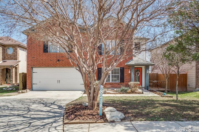 view of front of home featuring brick siding, driveway, a garage, and fence