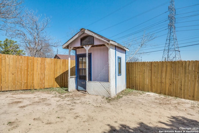 view of outbuilding with an outdoor structure and a fenced backyard