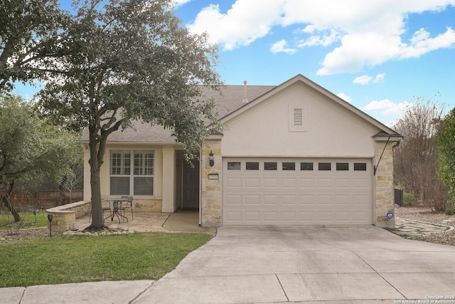 view of front of house featuring a garage, concrete driveway, stone siding, roof with shingles, and stucco siding