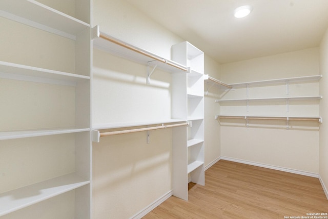 spacious closet with wood finished floors