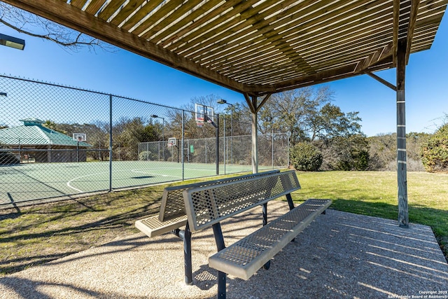 exterior space with community basketball court, fence, and a pergola