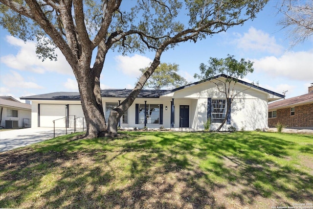 ranch-style home with central air condition unit, a front lawn, concrete driveway, and an attached garage